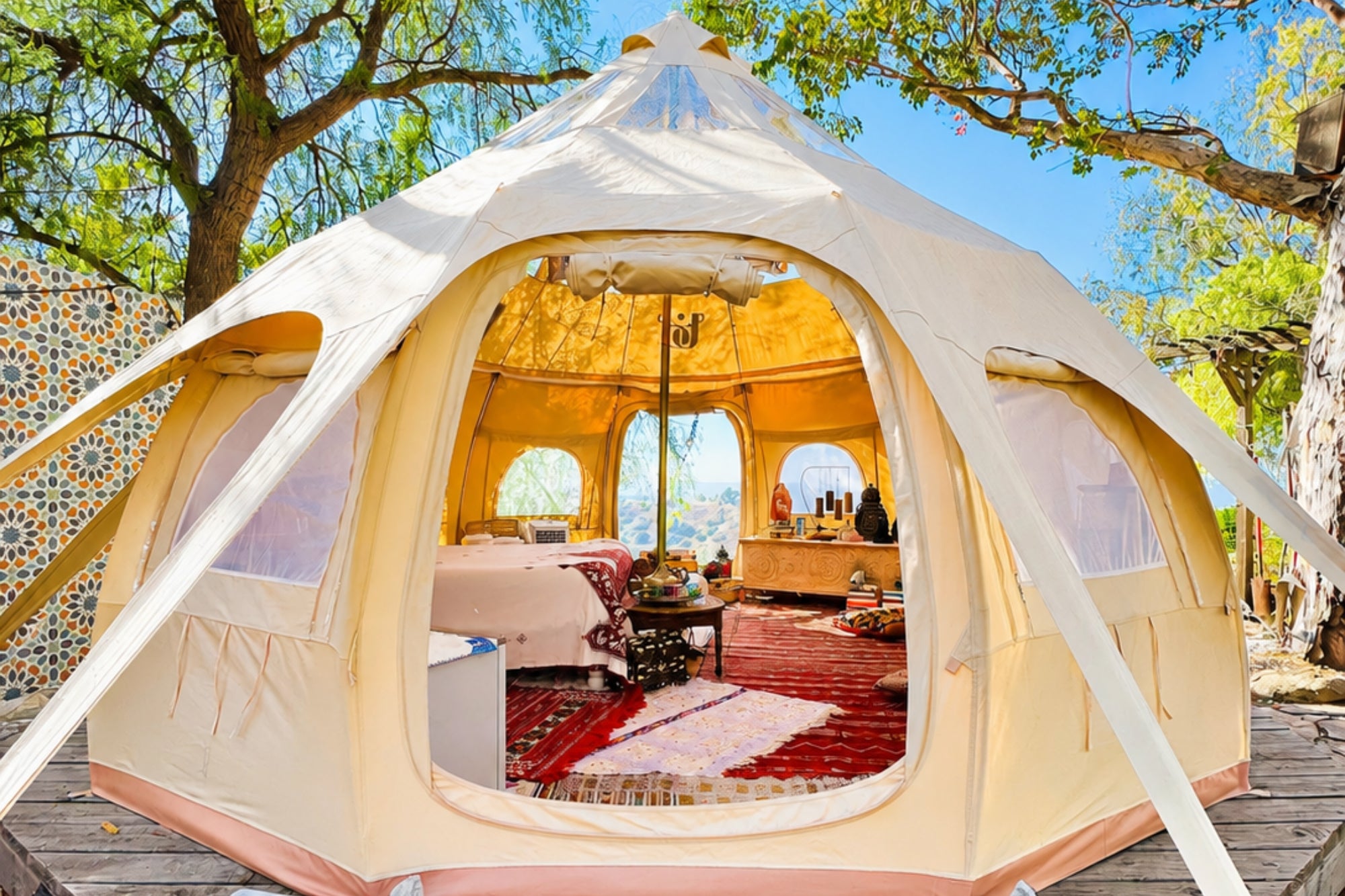 Better Bell luxury yurt tent exterior with open entrance and boho glamping interior